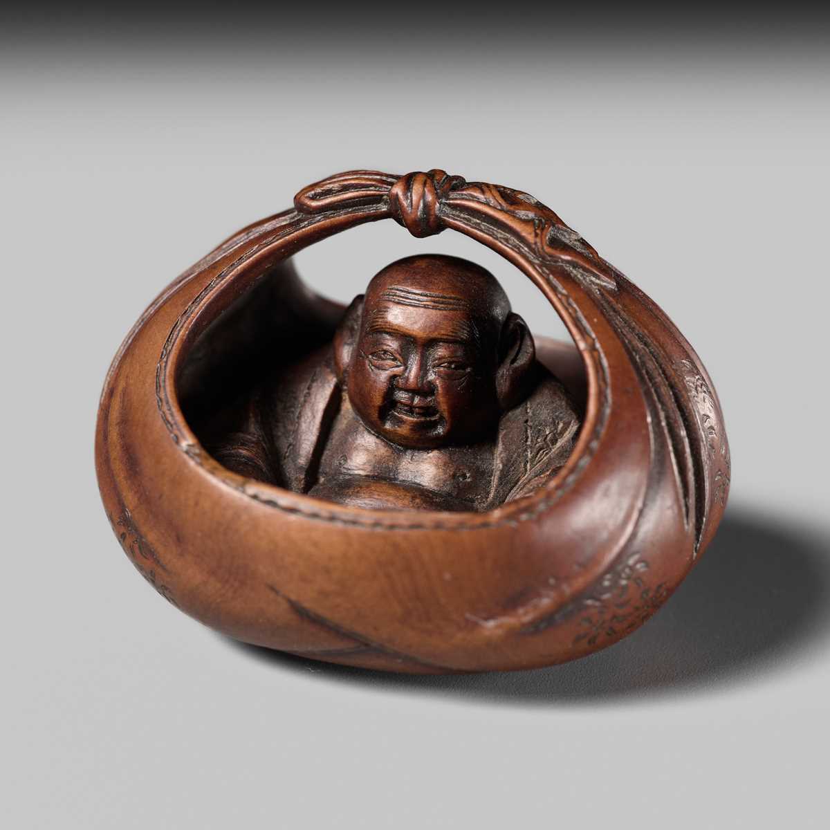 Lot 428 - HOSHUNSAI MASAYUKI: A FINE WOOD NETSUKE OF HOTEI IN HIS TREASURE BAG