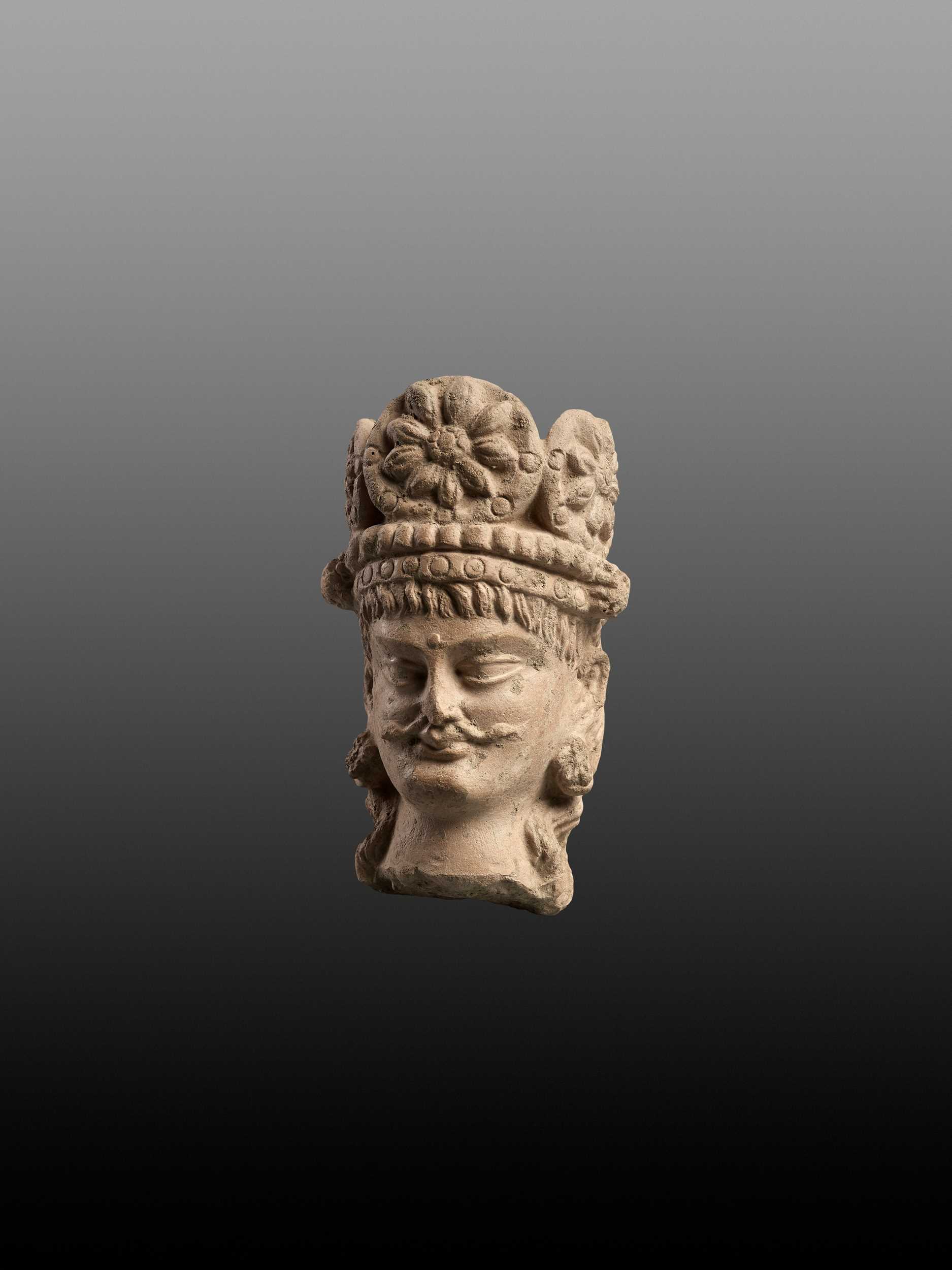 Lot 683 - A TERRACOTTA HEAD OF A BODHISATTVA, 3RD-5TH CENTURY