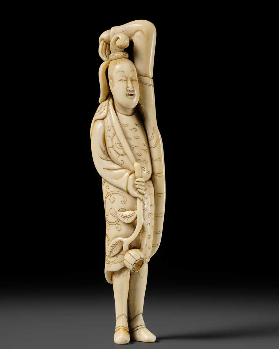 Lot 108 - A REMARKABLE TALL IVORY NETSUKE OF A YOUTHFUL CHINESE FIGURE