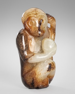 Lot 946 - A FINE PALE CELADON AND BROWN JADE PENDANT OF A MONKEY WITH PEACH, QING DYNASTY