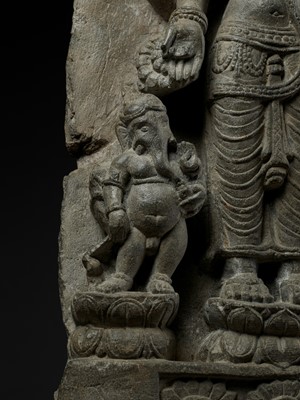 Lot 691 - AN IMPORTANT STONE STELE OF PARVATI WITH HER SONS GANESHA AND SKANDA