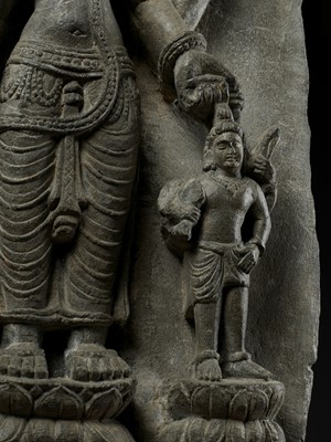 Lot 691 - AN IMPORTANT STONE STELE OF PARVATI WITH HER SONS GANESHA AND SKANDA