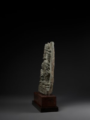 Lot 691 - AN IMPORTANT STONE STELE OF PARVATI WITH HER SONS GANESHA AND SKANDA