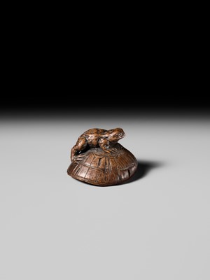Lot 188 - ICHIMIN: A FINE NAGOYA SCHOOL WOOD NETSUKE OF A TOAD ON A KASA HAT