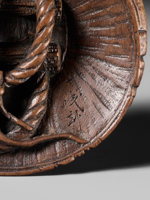 Lot 188 - ICHIMIN: A FINE NAGOYA SCHOOL WOOD NETSUKE OF A TOAD ON A KASA HAT