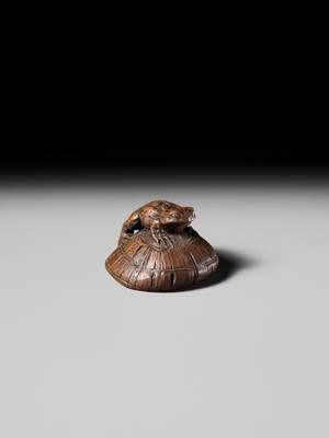 Lot 188 - ICHIMIN: A FINE NAGOYA SCHOOL WOOD NETSUKE OF A TOAD ON A KASA HAT