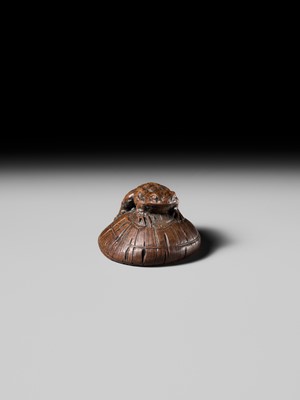 Lot 188 - ICHIMIN: A FINE NAGOYA SCHOOL WOOD NETSUKE OF A TOAD ON A KASA HAT