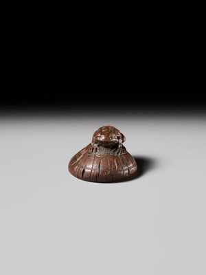 Lot 188 - ICHIMIN: A FINE NAGOYA SCHOOL WOOD NETSUKE OF A TOAD ON A KASA HAT