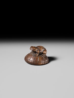 Lot 188 - ICHIMIN: A FINE NAGOYA SCHOOL WOOD NETSUKE OF A TOAD ON A KASA HAT