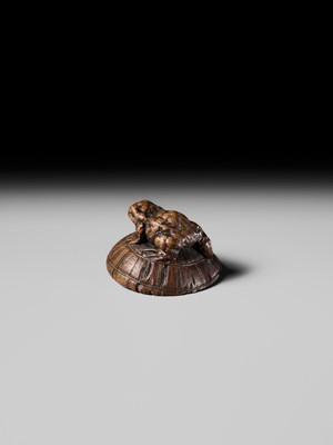 Lot 188 - ICHIMIN: A FINE NAGOYA SCHOOL WOOD NETSUKE OF A TOAD ON A KASA HAT