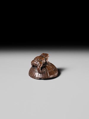 Lot 188 - ICHIMIN: A FINE NAGOYA SCHOOL WOOD NETSUKE OF A TOAD ON A KASA HAT