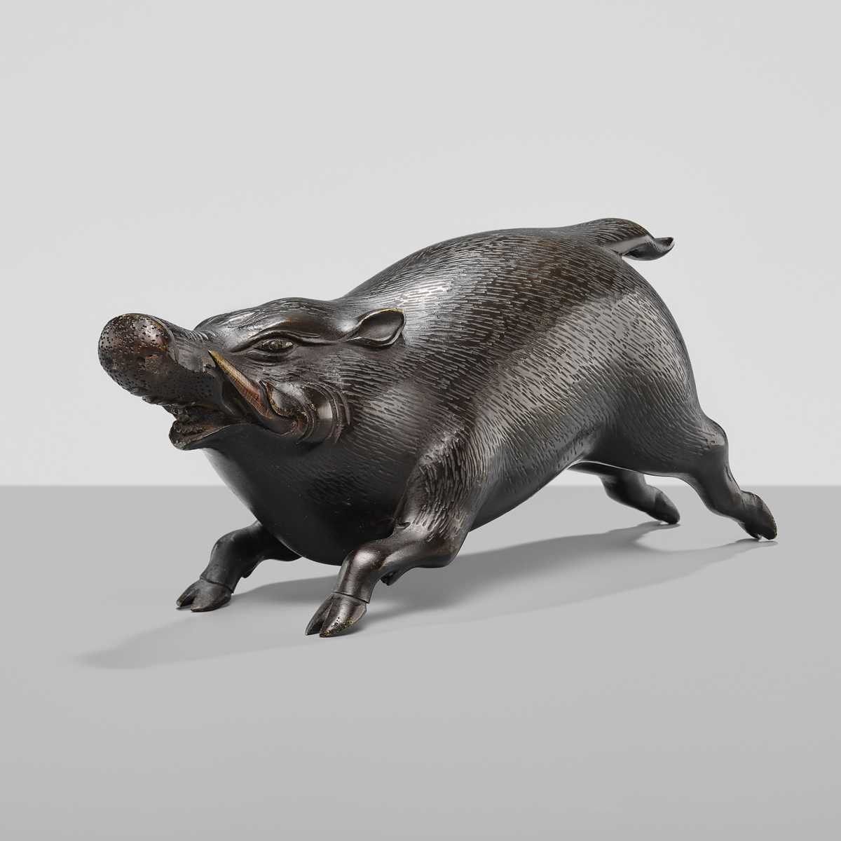 Lot 16 - A FINE BRONZE OKIMONO OF A CHARGING BOAR