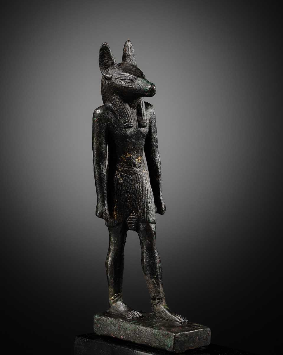 Lot 4 - A FINE AND RARE GILT-BRONZE FIGURE OF ANUBIS, LATE PERIOD