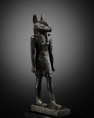 Lot 4 - A FINE AND RARE GILT-BRONZE FIGURE OF ANUBIS, LATE PERIOD