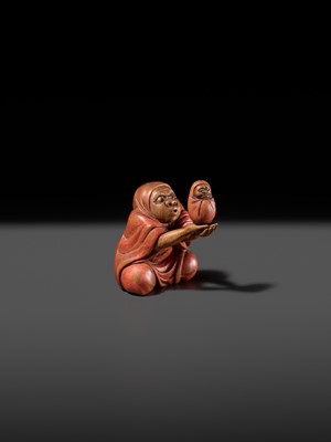 Lot 169 - AN AMUSING LACQUERED WOOD NETSUKE OF DARUMA BALANCING A DARUMA DOLL, ATTRIBUTED TO ANRAKU