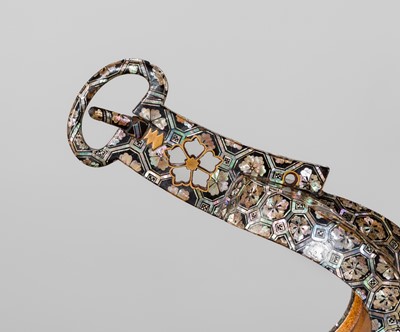 Lot 133 - A FINE PAIR OF MOTHER-OF-PEARL-INLAID LACQUERED IRON STIRRUPS (ABUMI)
