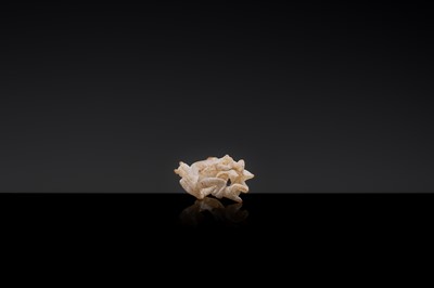 Lot 19 - A RETICULATED WHITE JADE MINIATURE PENDANT OF TWO FROLICKING TIGERS, WARRING STATES OR WESTERN HAN DYNASTY