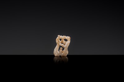 Lot 19 - A RETICULATED WHITE JADE MINIATURE PENDANT OF TWO FROLICKING TIGERS, WARRING STATES OR WESTERN HAN DYNASTY