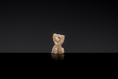 Lot 19 - A RETICULATED WHITE JADE MINIATURE PENDANT OF TWO FROLICKING TIGERS, WARRING STATES OR WESTERN HAN DYNASTY