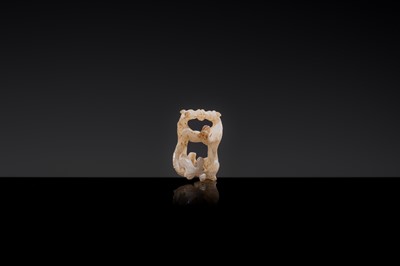Lot 19 - A RETICULATED WHITE JADE MINIATURE PENDANT OF TWO FROLICKING TIGERS, WARRING STATES OR WESTERN HAN DYNASTY