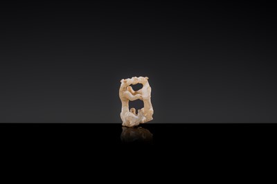 Lot 19 - A RETICULATED WHITE JADE MINIATURE PENDANT OF TWO FROLICKING TIGERS, WARRING STATES OR WESTERN HAN DYNASTY