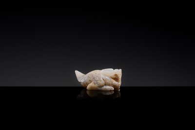 Lot 20 - A MOTTLED WHITE JADE CARVING OF A BIXIE, SIX DYNASTIES PERIOD