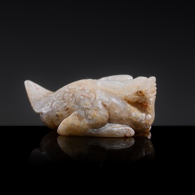 Lot 20 - A MOTTLED WHITE JADE CARVING OF A BIXIE, SIX DYNASTIES PERIOD