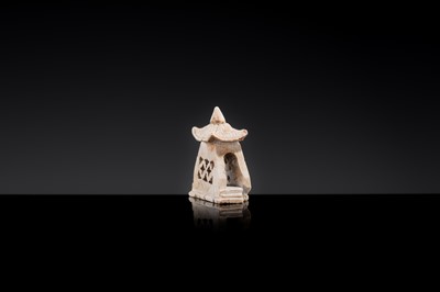 Lot 21 - A MINIATURE ‘CHICKEN BONE’ JADE PAGODA, TANG DYNASTY