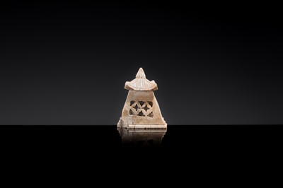 Lot 21 - A MINIATURE ‘CHICKEN BONE’ JADE PAGODA, TANG DYNASTY