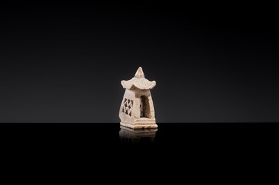 Lot 21 - A MINIATURE ‘CHICKEN BONE’ JADE PAGODA, TANG DYNASTY