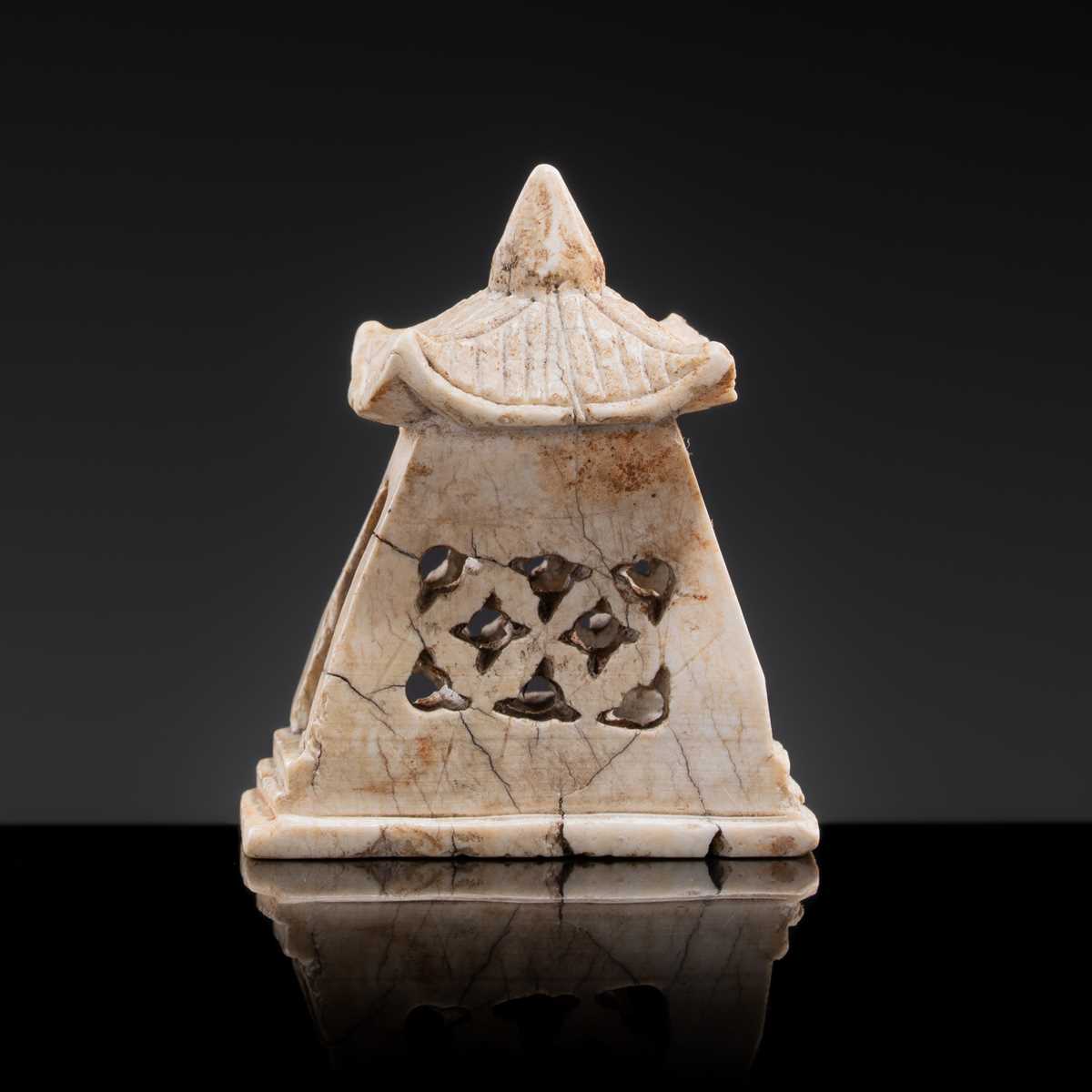 Lot 21 - A MINIATURE ‘CHICKEN BONE’ JADE PAGODA, TANG DYNASTY