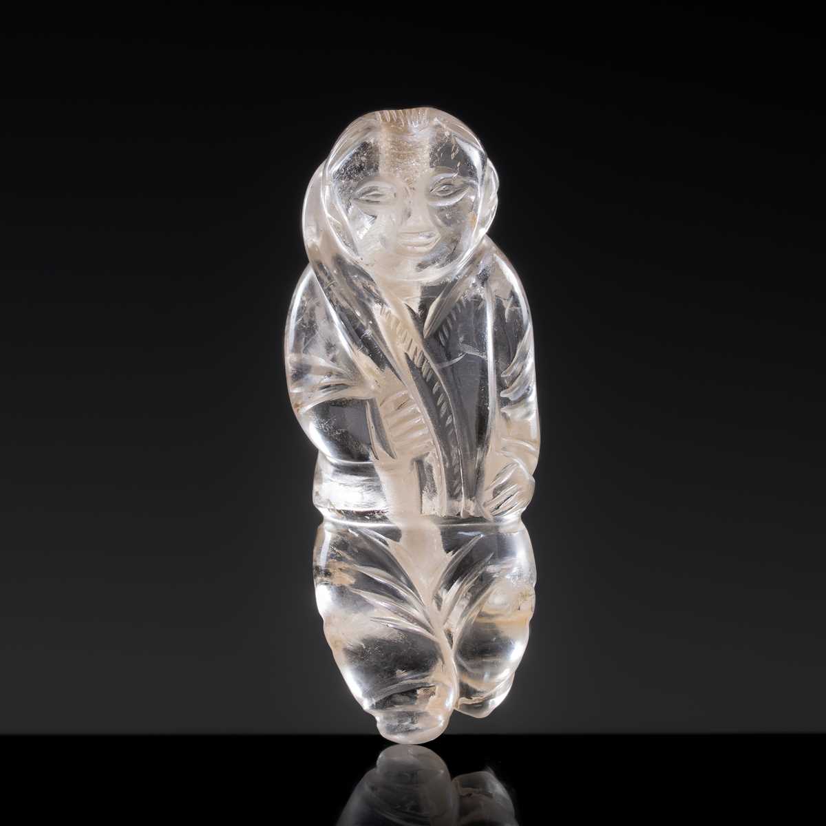 Lot 25 - A CHARMING ROCK CRYSTAL ‘BOY WITH LOTUS’ PENDANT, LIAO DYNASTY