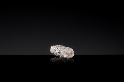 Lot 25 - A CHARMING ROCK CRYSTAL ‘BOY WITH LOTUS’ PENDANT, LIAO DYNASTY