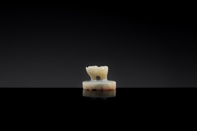 Lot 22 - A PALE CELADON JADE ‘OX’ SEAL, YUAN DYNASTY