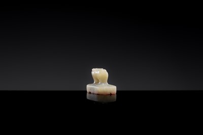 Lot 22 - A PALE CELADON JADE ‘OX’ SEAL, YUAN DYNASTY