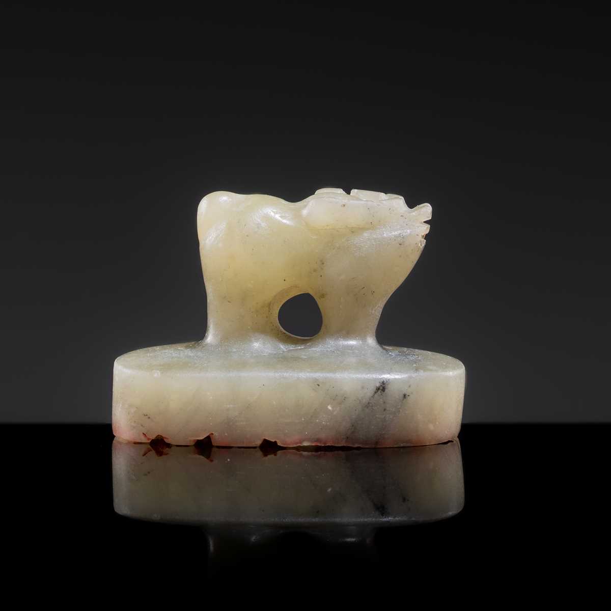 Lot 22 - A PALE CELADON JADE ‘OX’ SEAL, YUAN DYNASTY