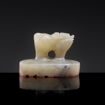 Lot 22 - A PALE CELADON JADE ‘OX’ SEAL, YUAN DYNASTY