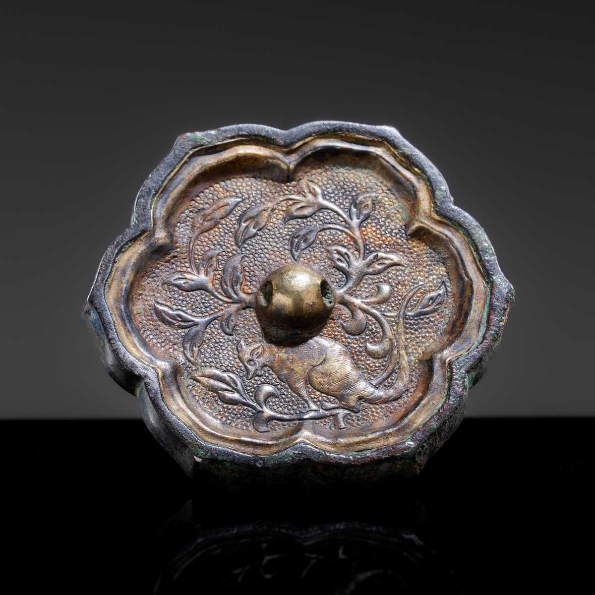 A GILT METAL-SHEET INLAID SILVER ‘SLEEVE’ MIRROR WITH A SQUIRREL, TANG DYNASTY