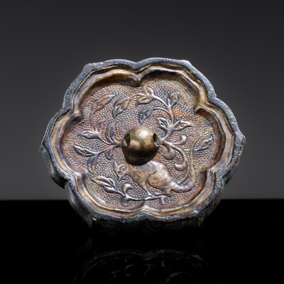 Lot 11 - A GILT METAL-SHEET INLAID SILVER ‘SLEEVE’ MIRROR WITH A SQUIRREL, TANG DYNASTY