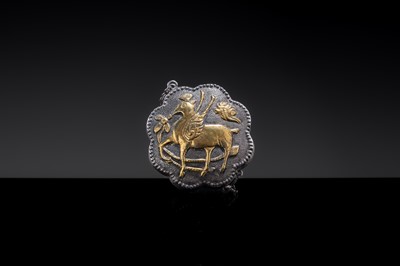 Lot 13 - A MINIATURE PARCEL-GILT SILVER ‘WINGED DEER’ BOX AND COVER, TANG DYNASTY