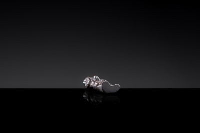 Lot 15 - A SMALL BRONZE FIGURE OF AN ADORANT, LATE TANG TO SONG DYNASTY