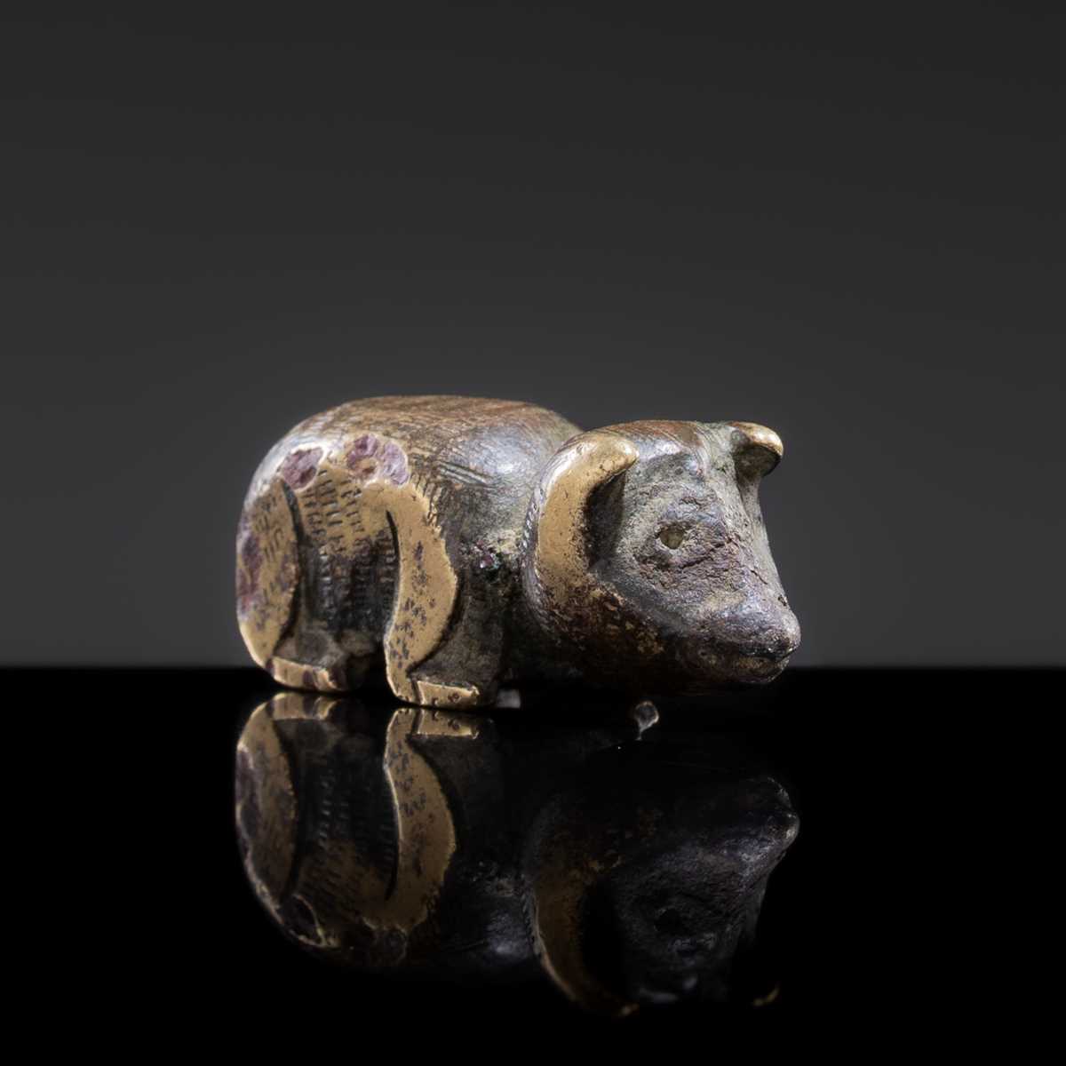 Lot 17 - A BRONZE MINIATURE FIGURE OF A WILD BEAST, SONG TO MING DYNASTY