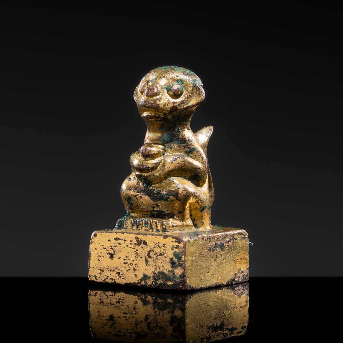 Lot 10 - A GILT BRONZE ‘MONKEY AND PEACH’ SEAL, NORTHERN WEI DYNASTY