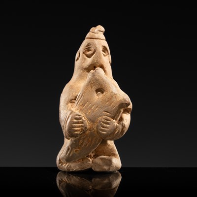 Lot 32 - AN EARTHENWARE FIGURE OF A XIANBEI WOMAN HOLDING A LAMB, LATE EASTERN HAN TO SIX DYNASTIES PERIOD