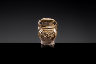A MINIATURE YUEYAO GREEN GLAZED ‘DEMON MASK’ POTTERY JAR, EASTERN JIN DYNASTY