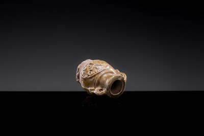 A MINIATURE YUEYAO GREEN GLAZED ‘DEMON MASK’ POTTERY JAR, EASTERN JIN DYNASTY