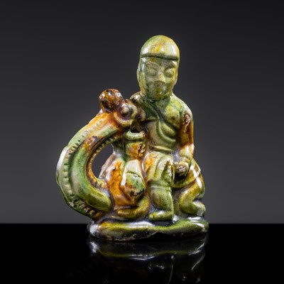 A SANCAI-GLAZED POTTERY FIGURE OF A CAMEL RIDER, TANG DYNASTY