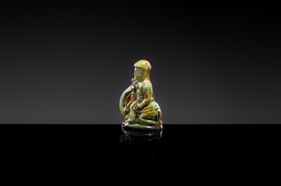 A SANCAI-GLAZED POTTERY FIGURE OF A CAMEL RIDER, TANG DYNASTY