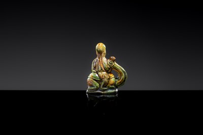 A SANCAI-GLAZED POTTERY FIGURE OF A CAMEL RIDER, TANG DYNASTY