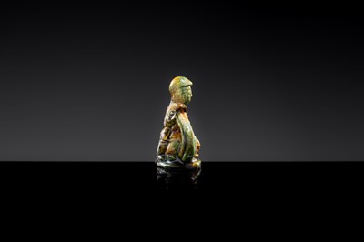 A SANCAI-GLAZED POTTERY FIGURE OF A CAMEL RIDER, TANG DYNASTY